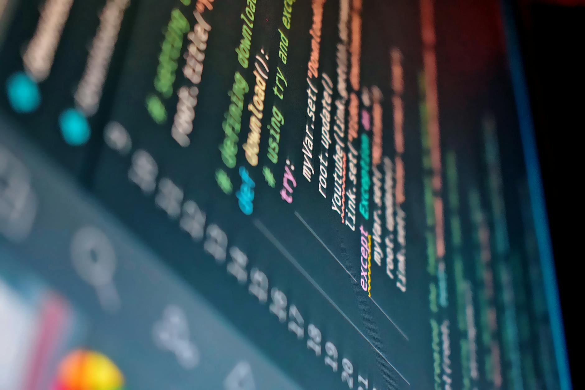 Developer working on code with multiple monitors displaying programming interfaces