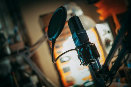 Professional podcast recording setup with microphone and audio equipment