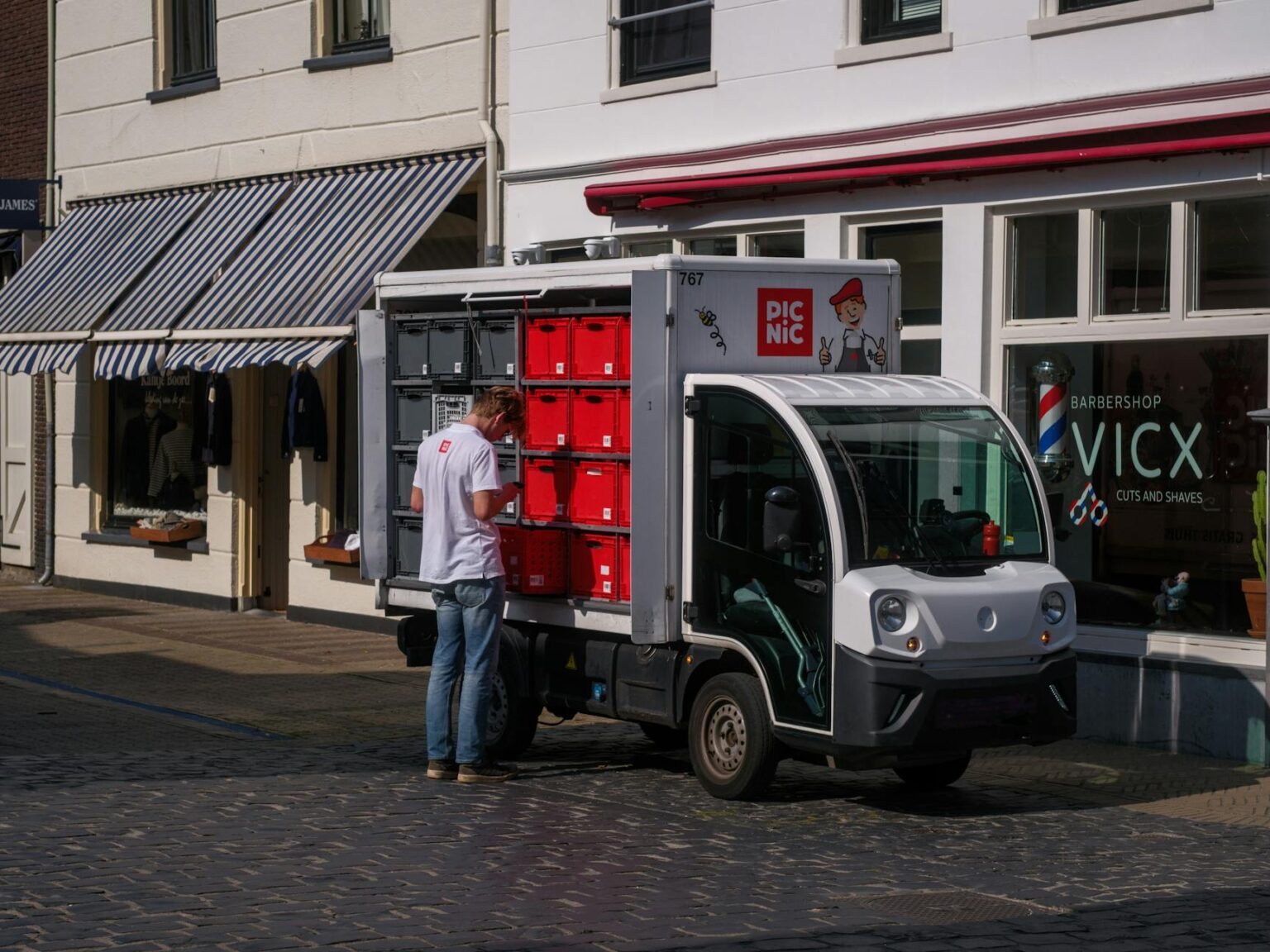 Electric delivery truck parked on European city street
