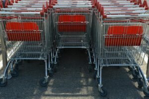 Why Major Grocery Chains Are Installing Smart Shopping Carts with Built-In Scales Modern shopping cart in grocery store produce section with digital display