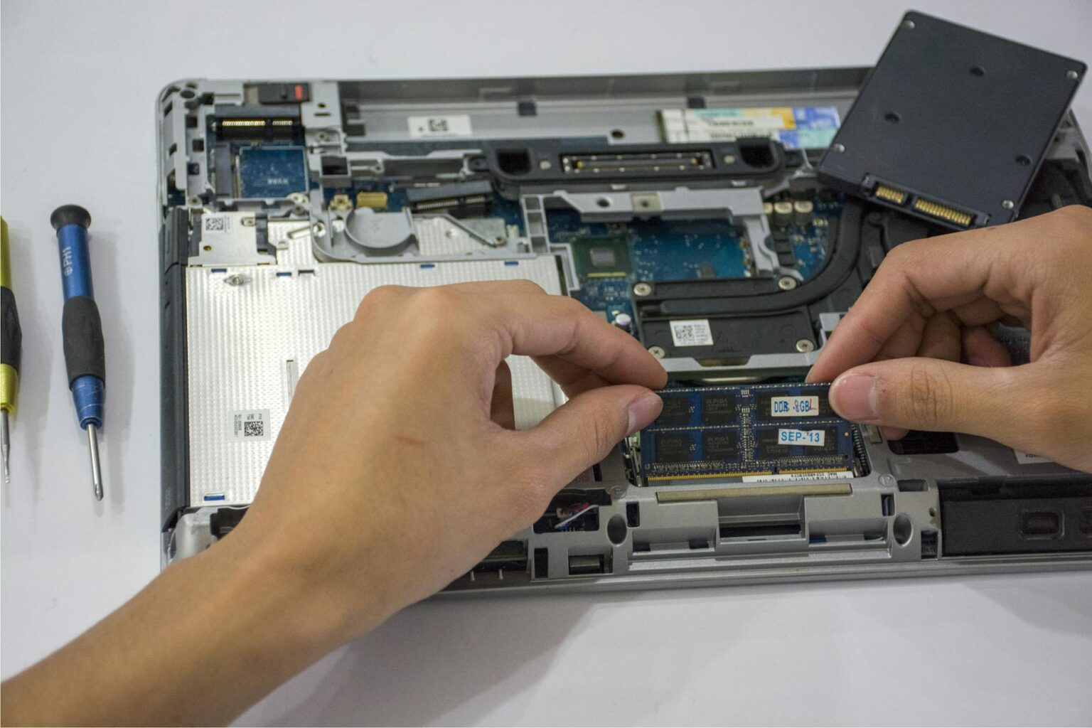Close-up view of laptop internal components and circuit boards showing modular design elements