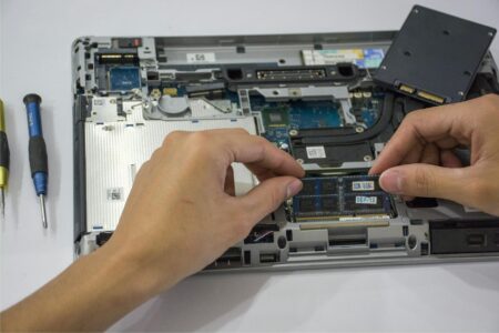Close-up view of laptop internal components and circuit boards showing modular design elements