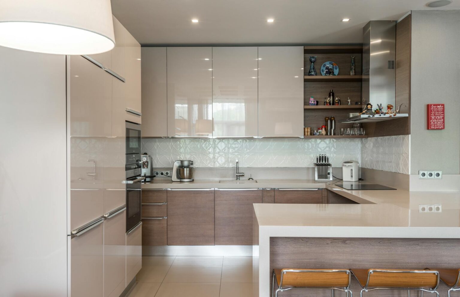 Modern kitchen interior with clean countertops and wall space suitable for smart display mounting