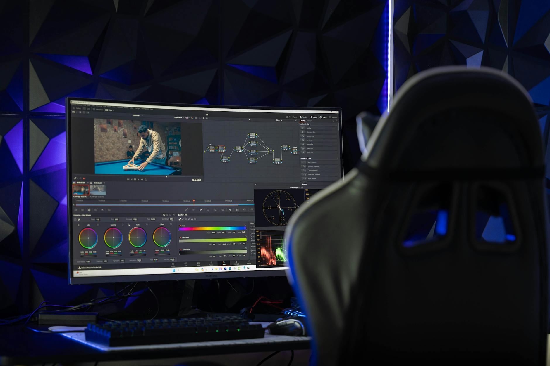 Content creator working on video editing with multiple screens showing YouTube analytics and editing software