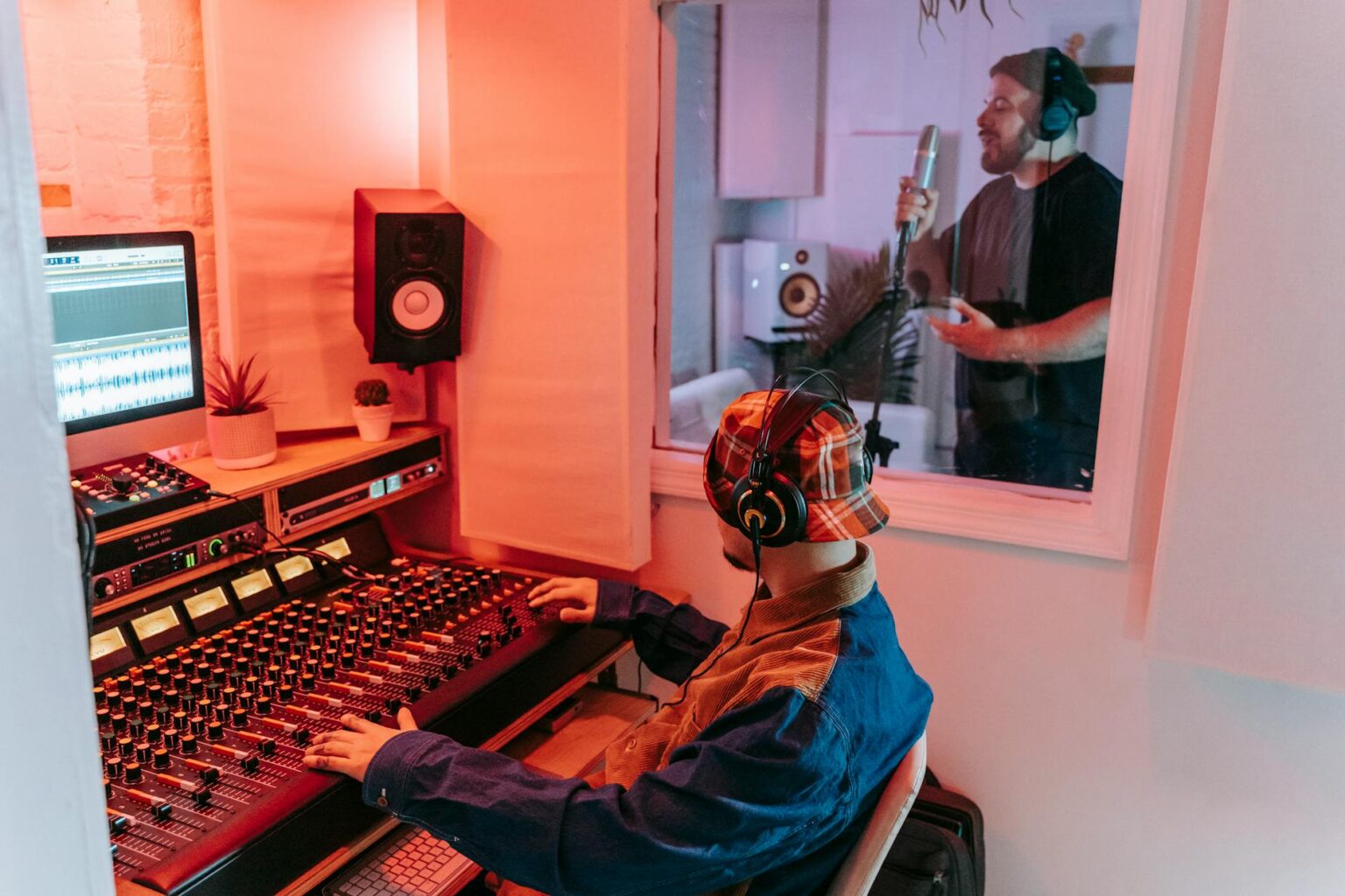 How AI-Generated Music Is Disrupting Spotify’s Royalty Payment System Professional music recording studio with mixing equipment and monitors