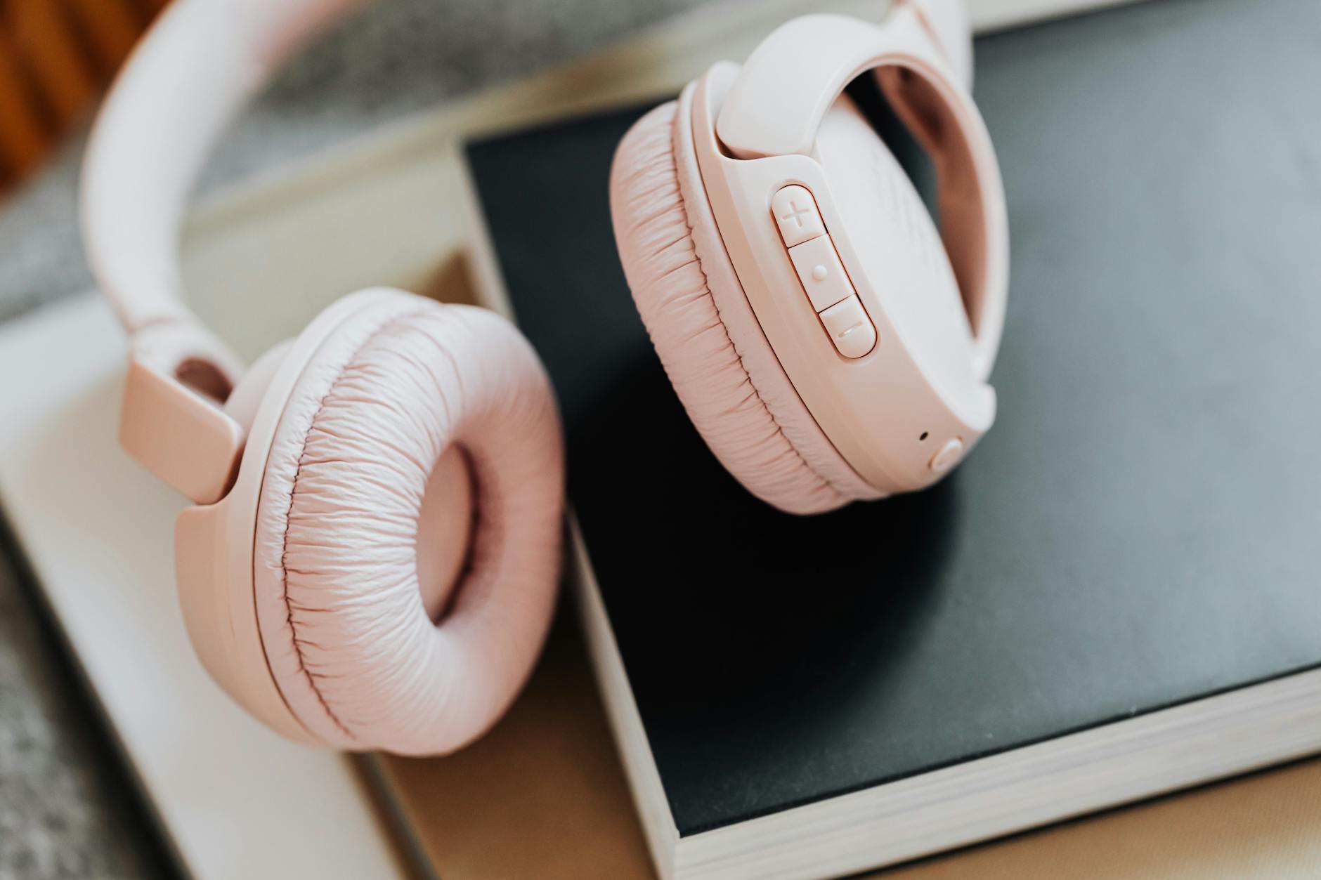 Professional headphones on a clean desk workspace representing audio-focused remote work