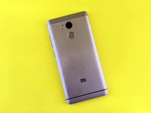 How Passkey Authentication Is Finally Killing Traditional Passwords Close-up of finger touching smartphone fingerprint sensor for biometric authentication