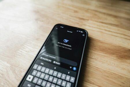 Person checking smartphone showing various app notifications and screen time statistics