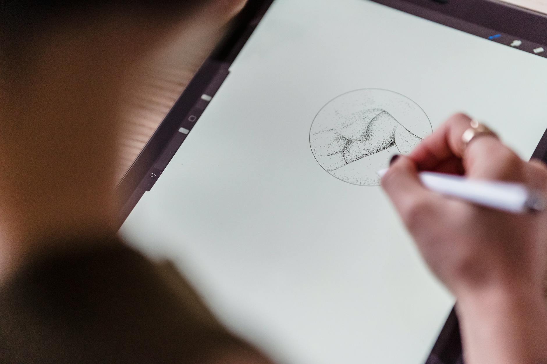 Digital tablet with stylus pen for note-taking on modern desk