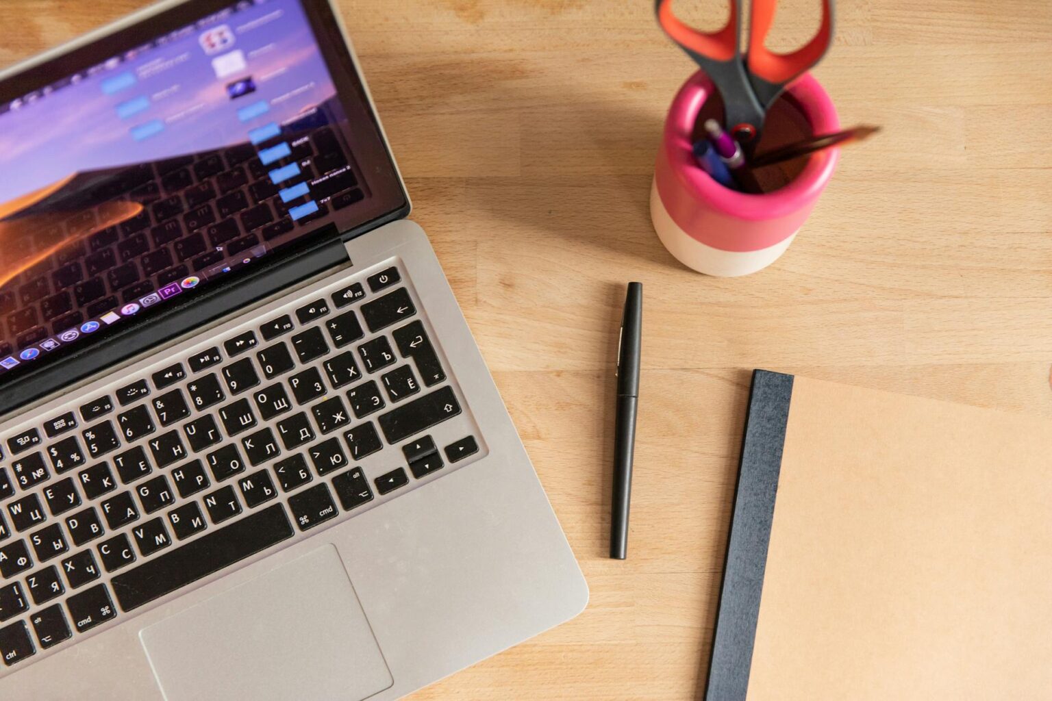 Modern laptop computer on clean desk workspace with creative tools