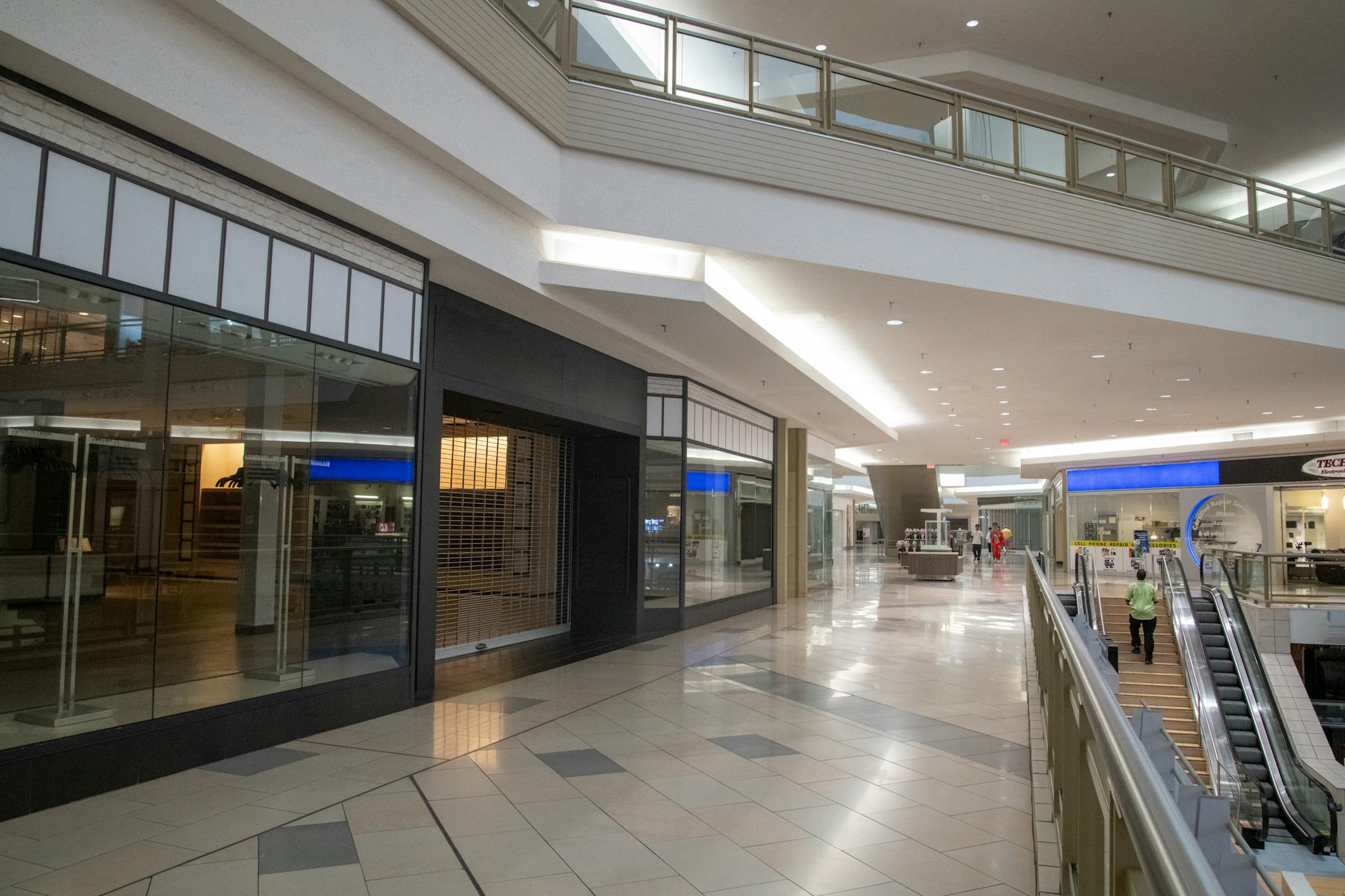 Interior view of a shopping mall corridor showing retail spaces and modern architecture