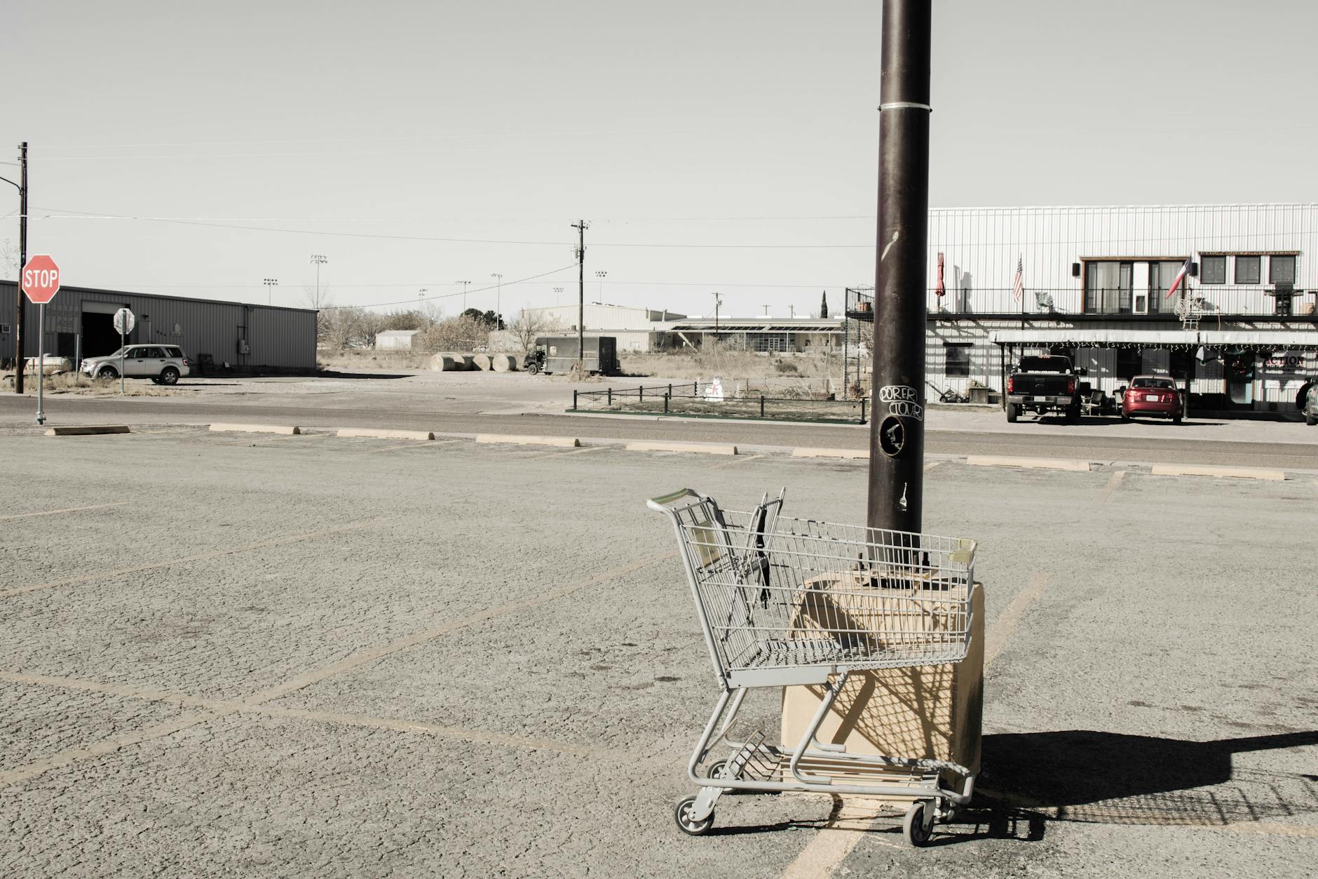 Large retail store parking lot with empty spaces that could be converted to vertical farming installations