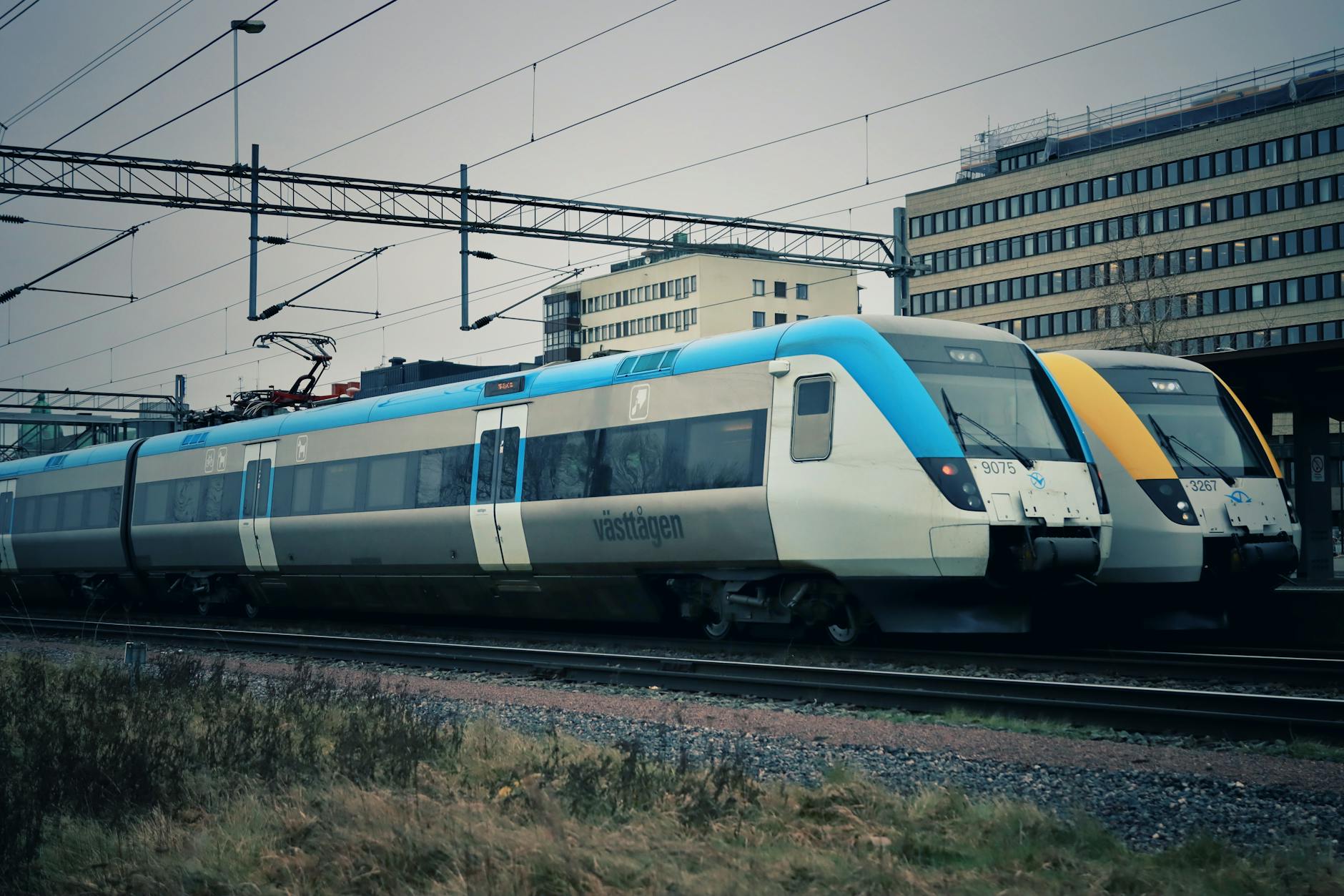 Interior view of modern commuter train with passengers during rush hour