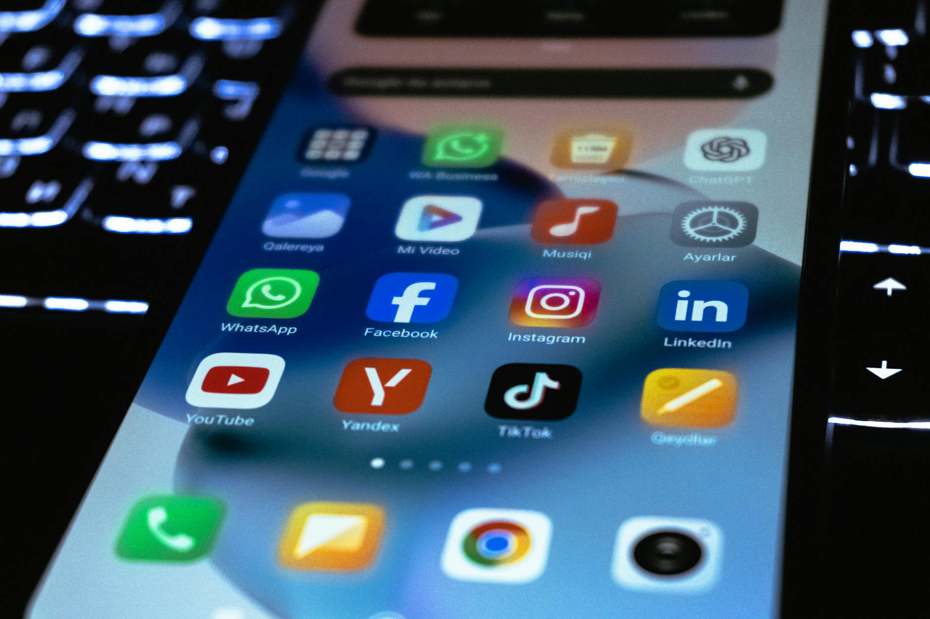 Person holding smartphone displaying social media app interface