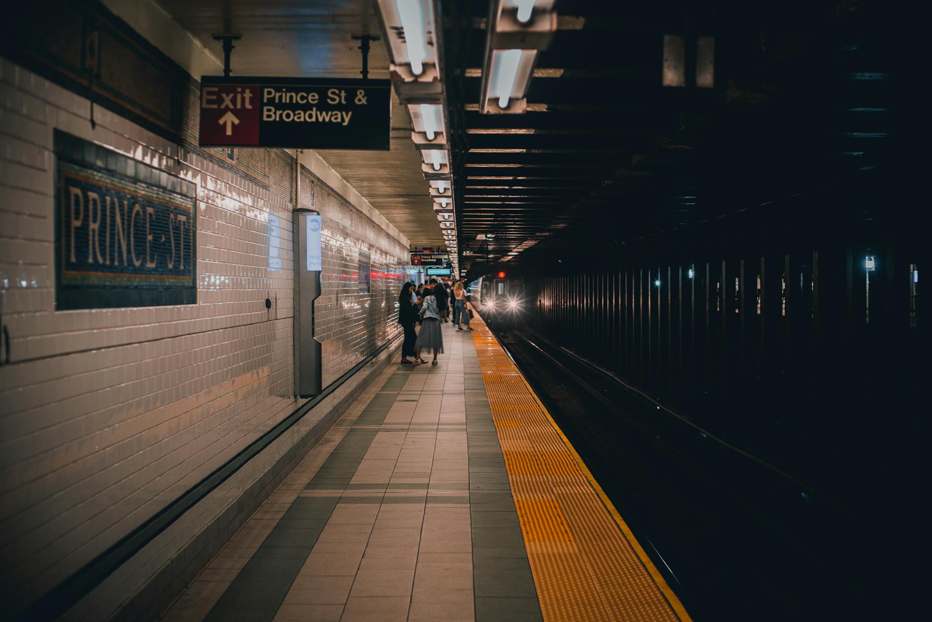 Busy subway platform with commuters demonstrating noisy environment for noise cancellation testing