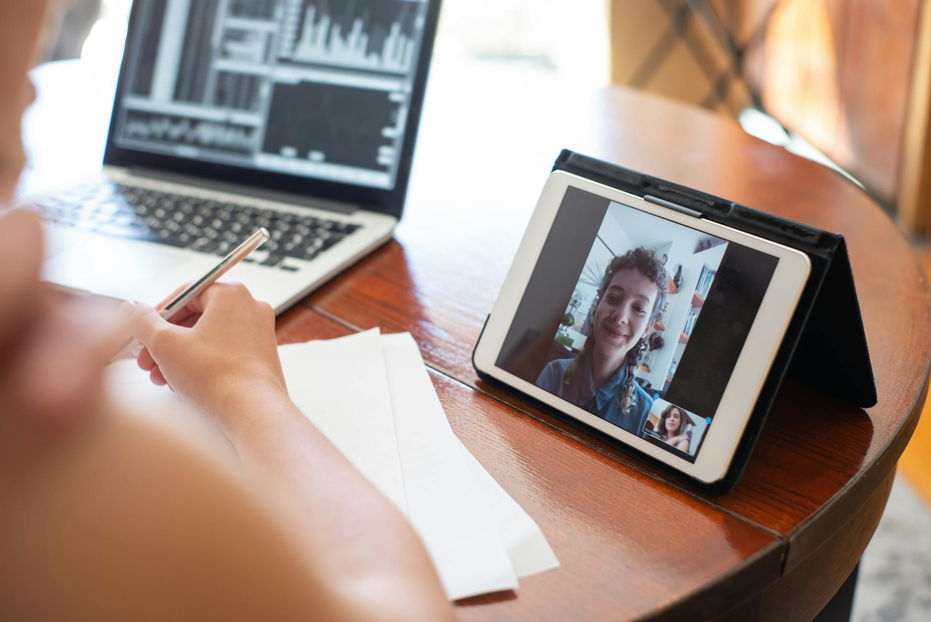 Professional person participating in a video conference call on laptop