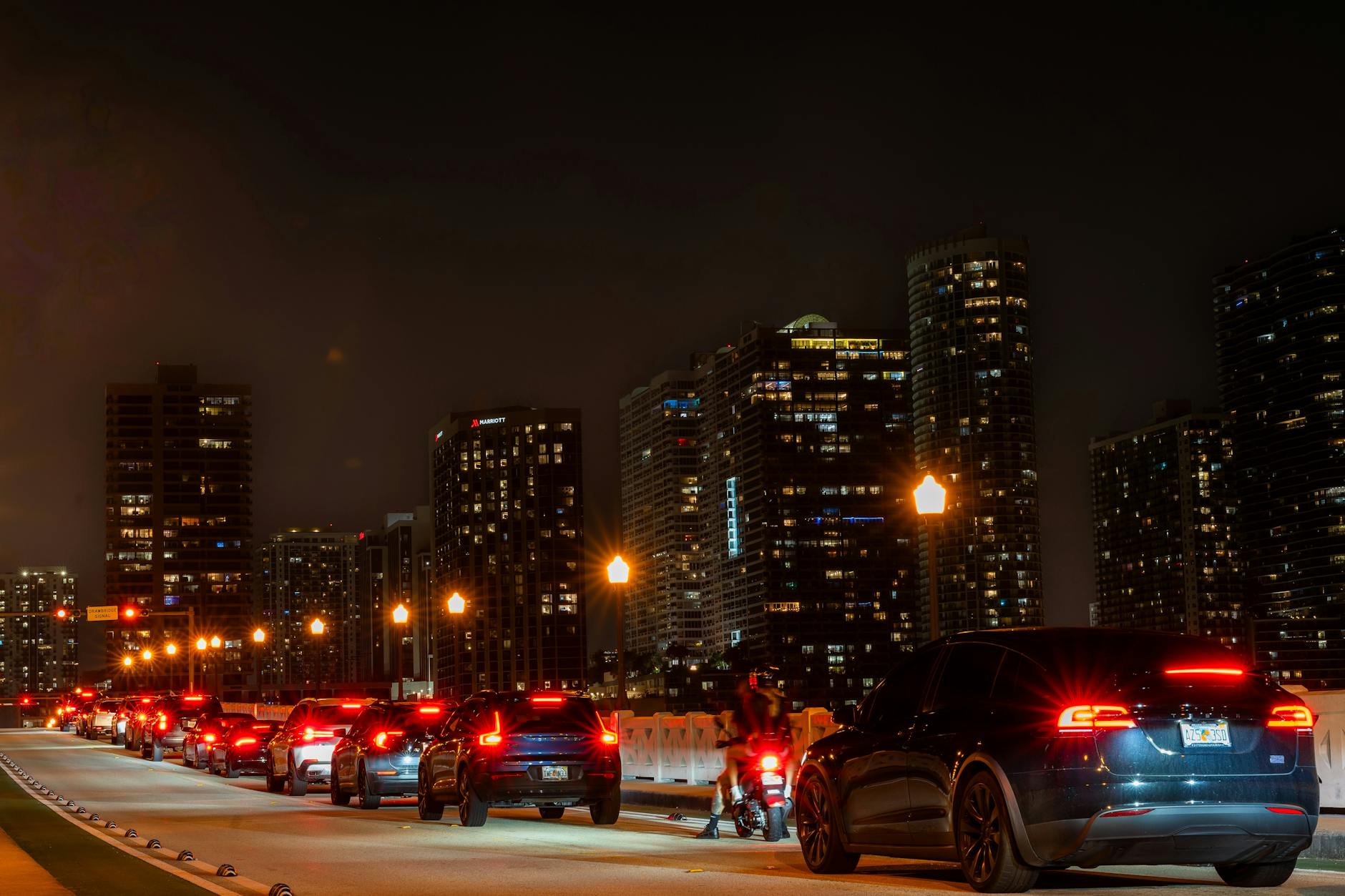Busy city street with multiple lanes of traffic during rush hour