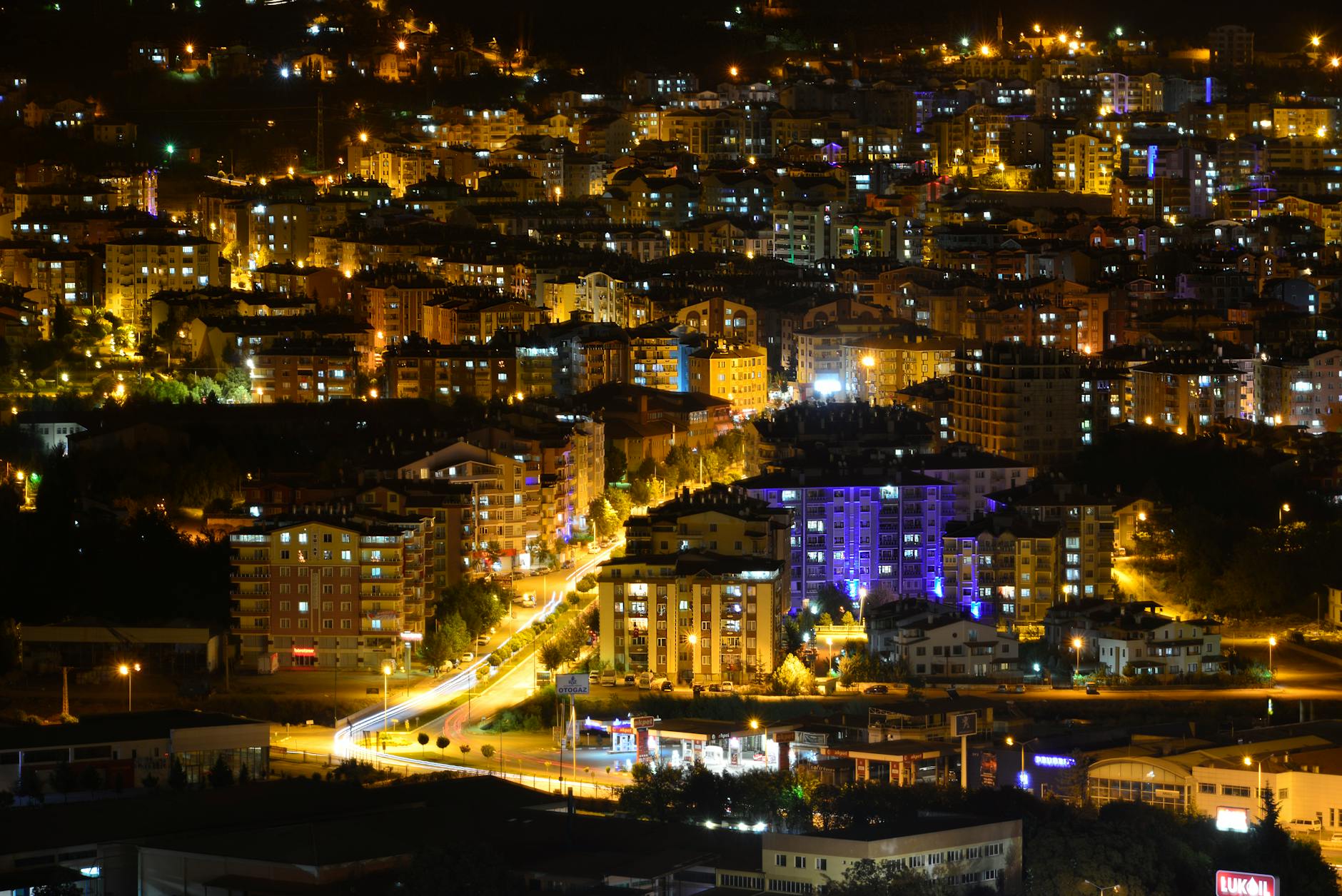 Urban nighttime scene with street lights and buildings, perfect for testing low-light camera performance