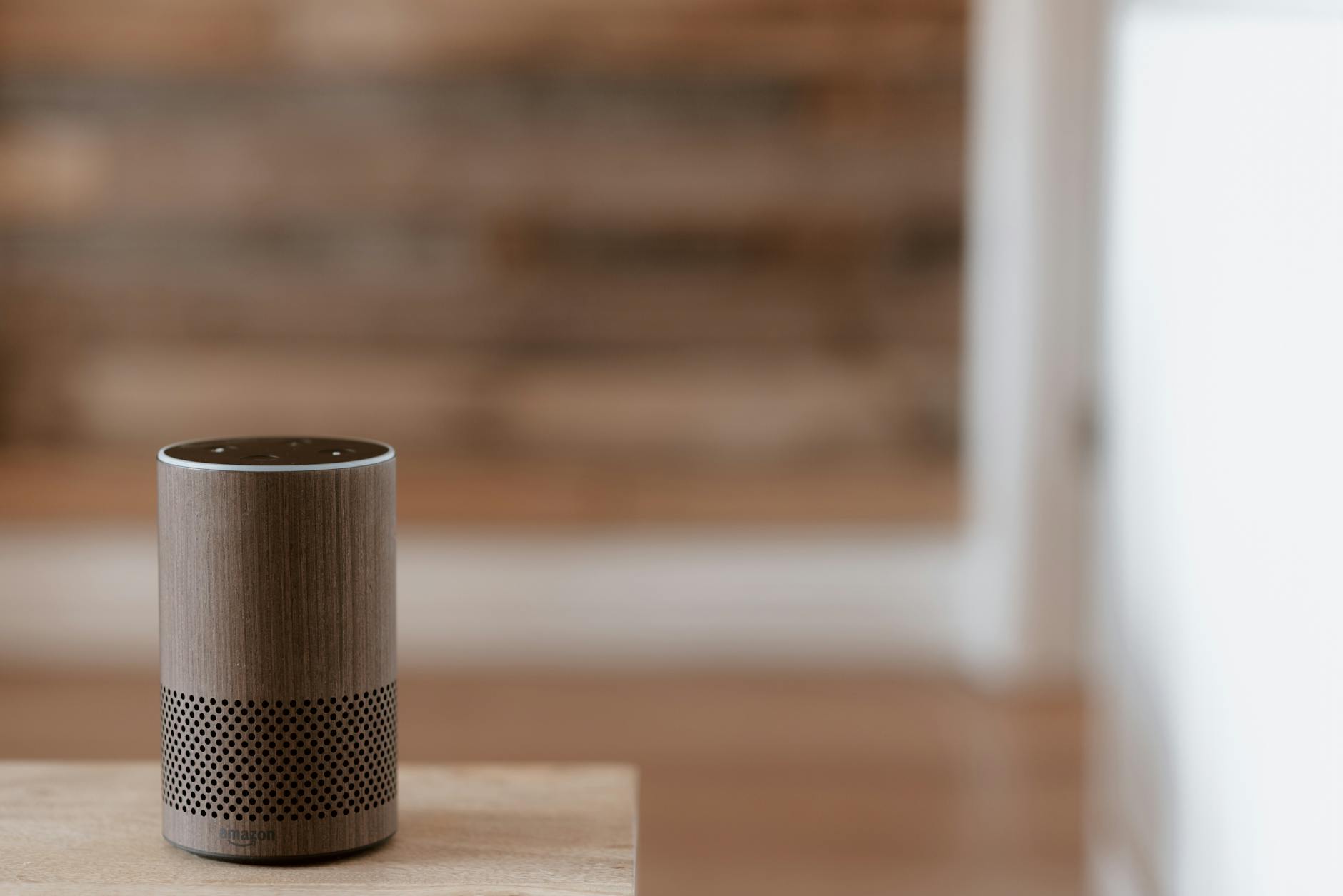 Smart speaker device on table in modern home interior