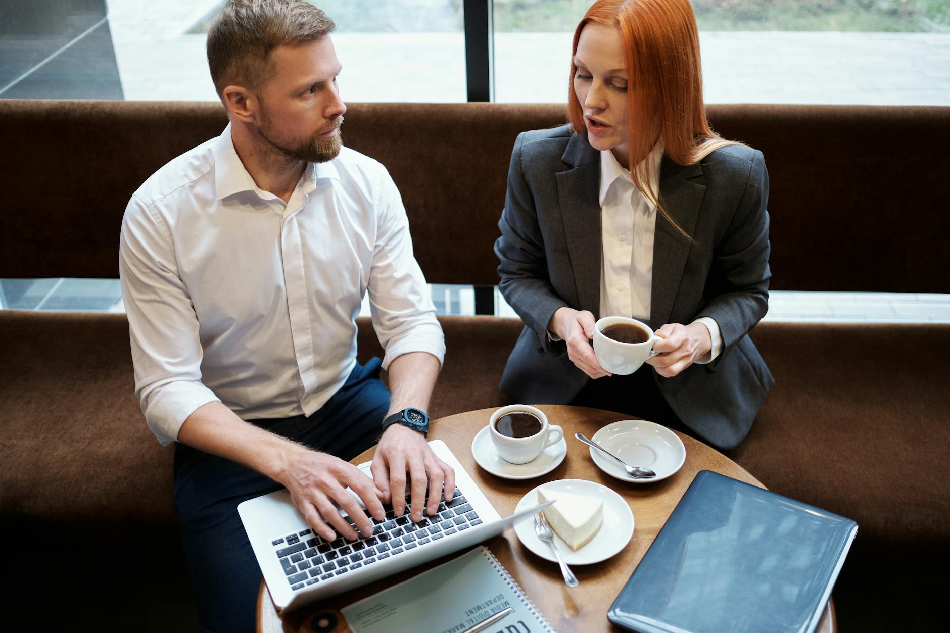 Professional using laptop during business meeting or collaboration session