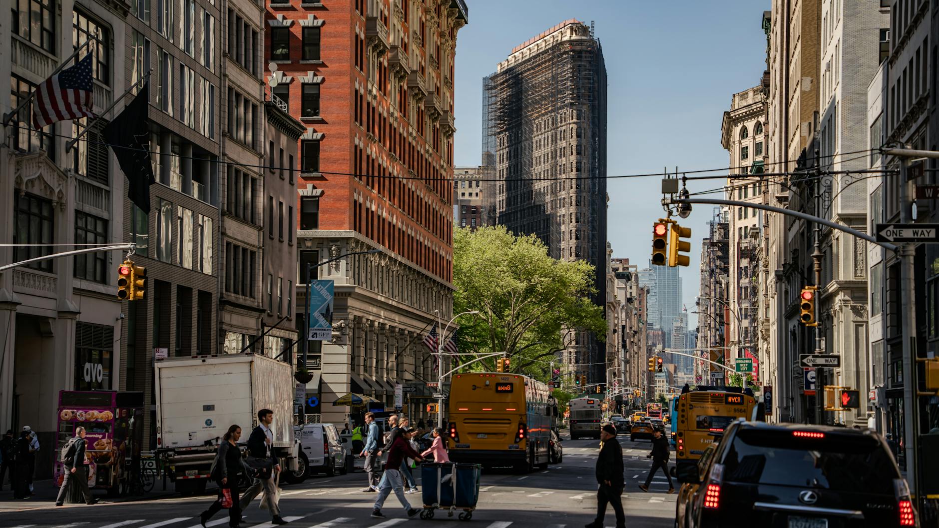 Busy urban street scene where electric scooter theft commonly occurs and GPS tracking proves valuable