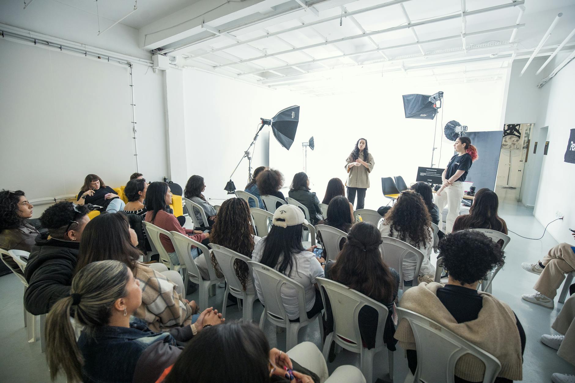 Diverse group of people working together at a community workshop table
