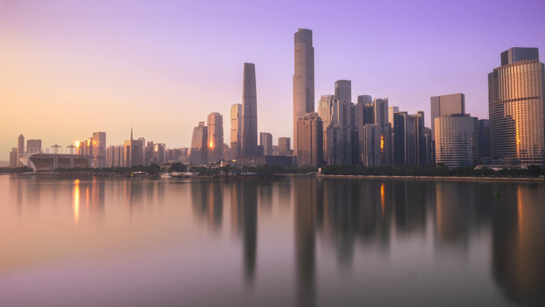 Urban cityscape at sunset highlighting sustainable development and renewable energy integration
