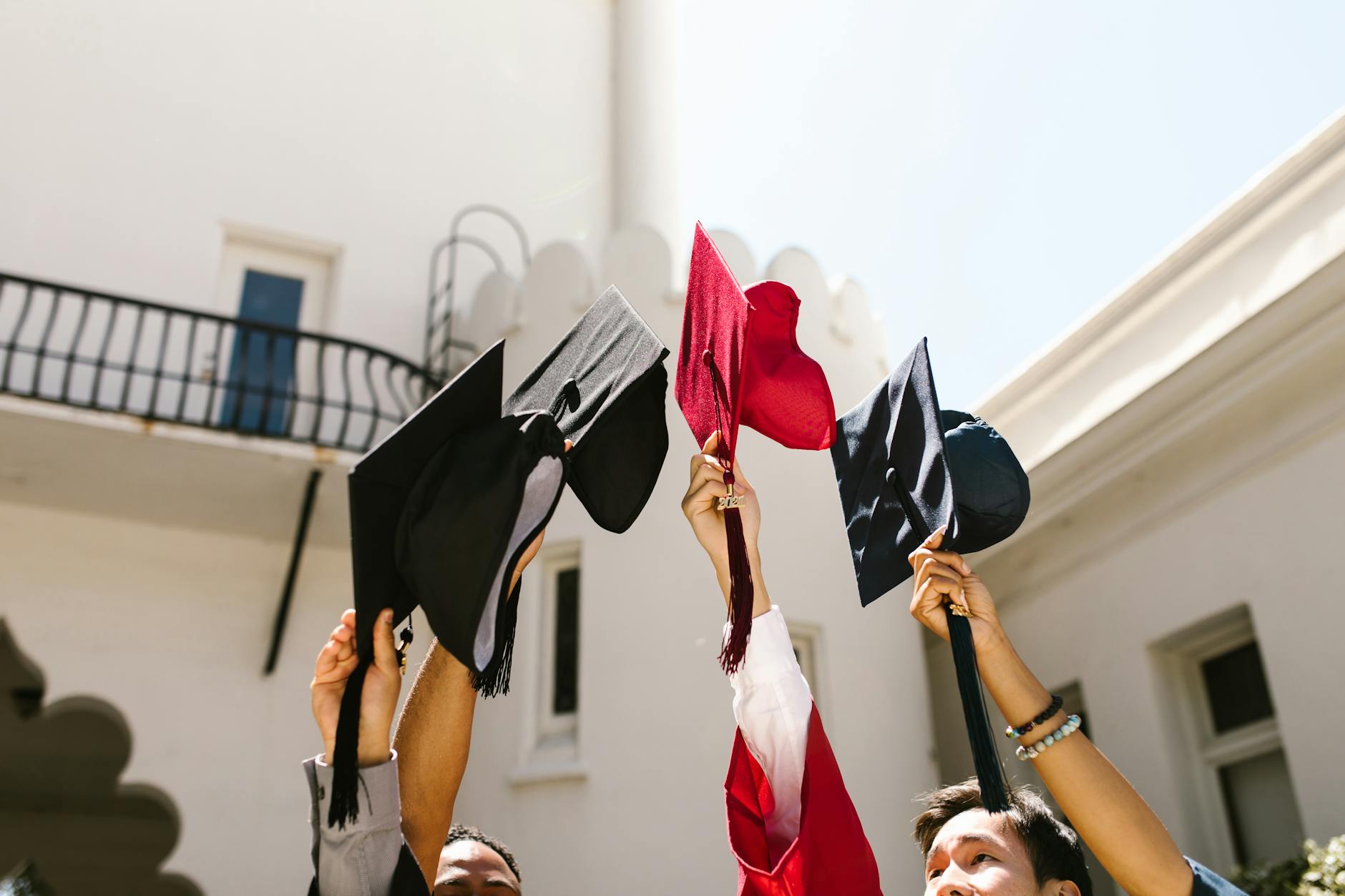 Graduation caps thrown in the air during university commencement ceremony