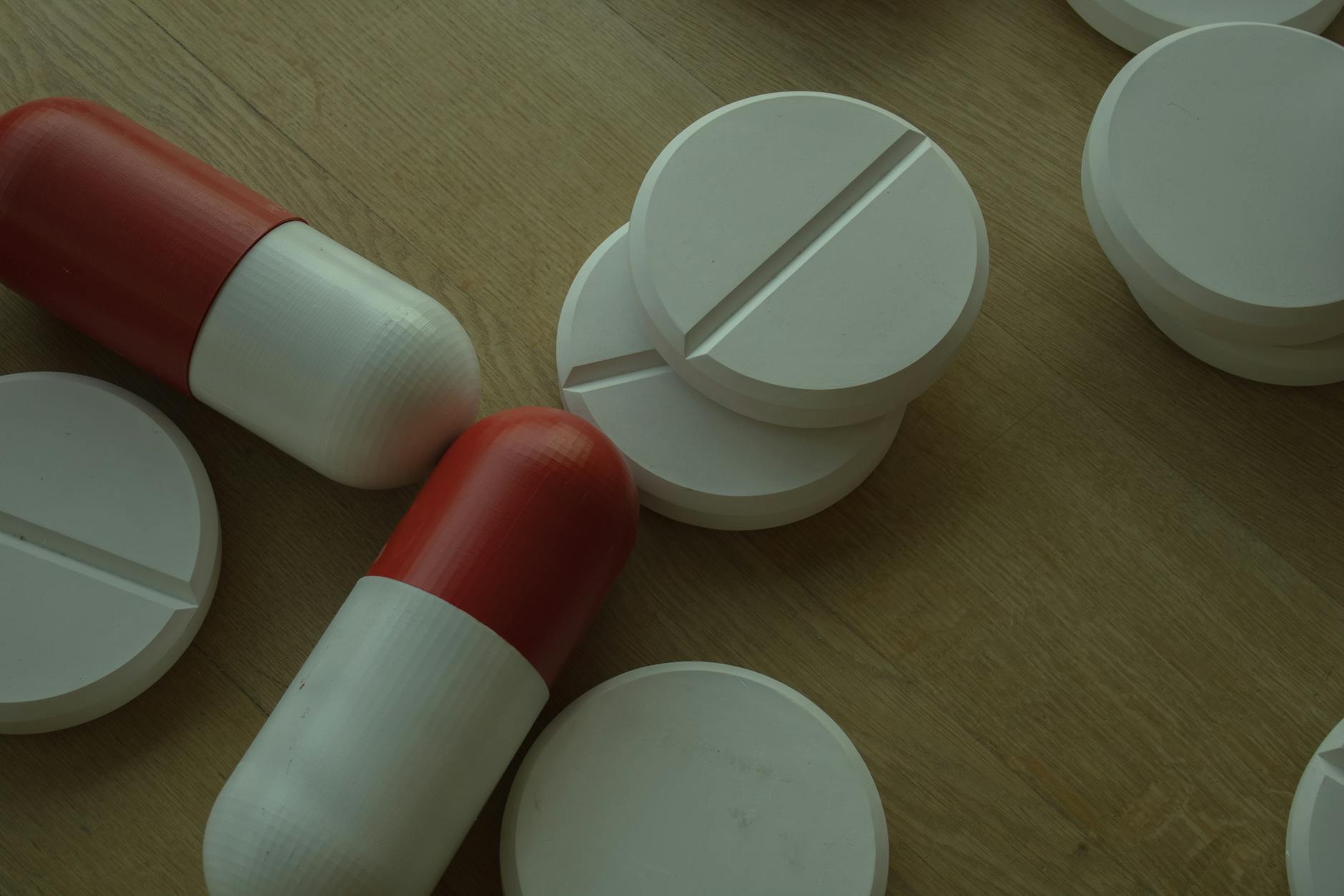 Various pharmaceutical pills and medications arranged on clean surface