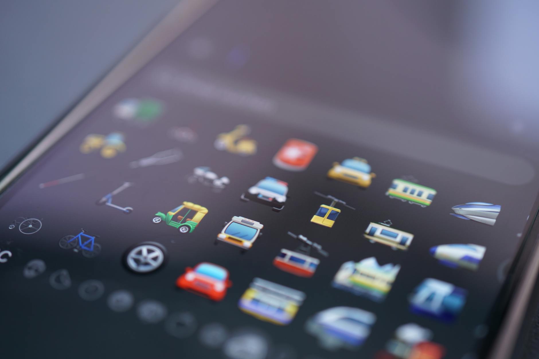 Close-up of smartphone screen displaying various colorful mobile app icons