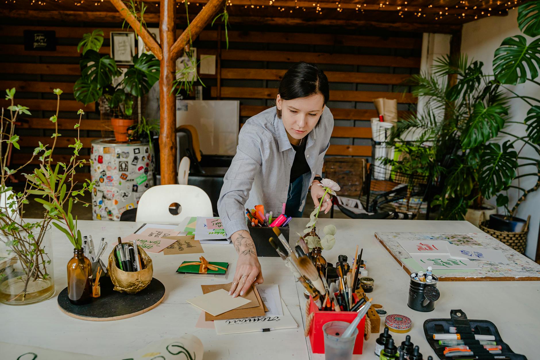 Modern digital artist workspace with tablet, stylus, and creative tools on desk