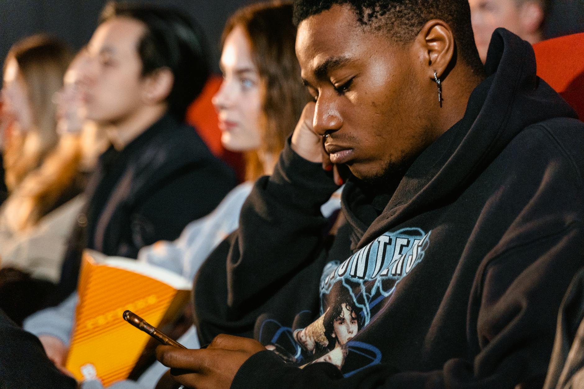 Audience watching gaming competition on large screens in an entertainment venue