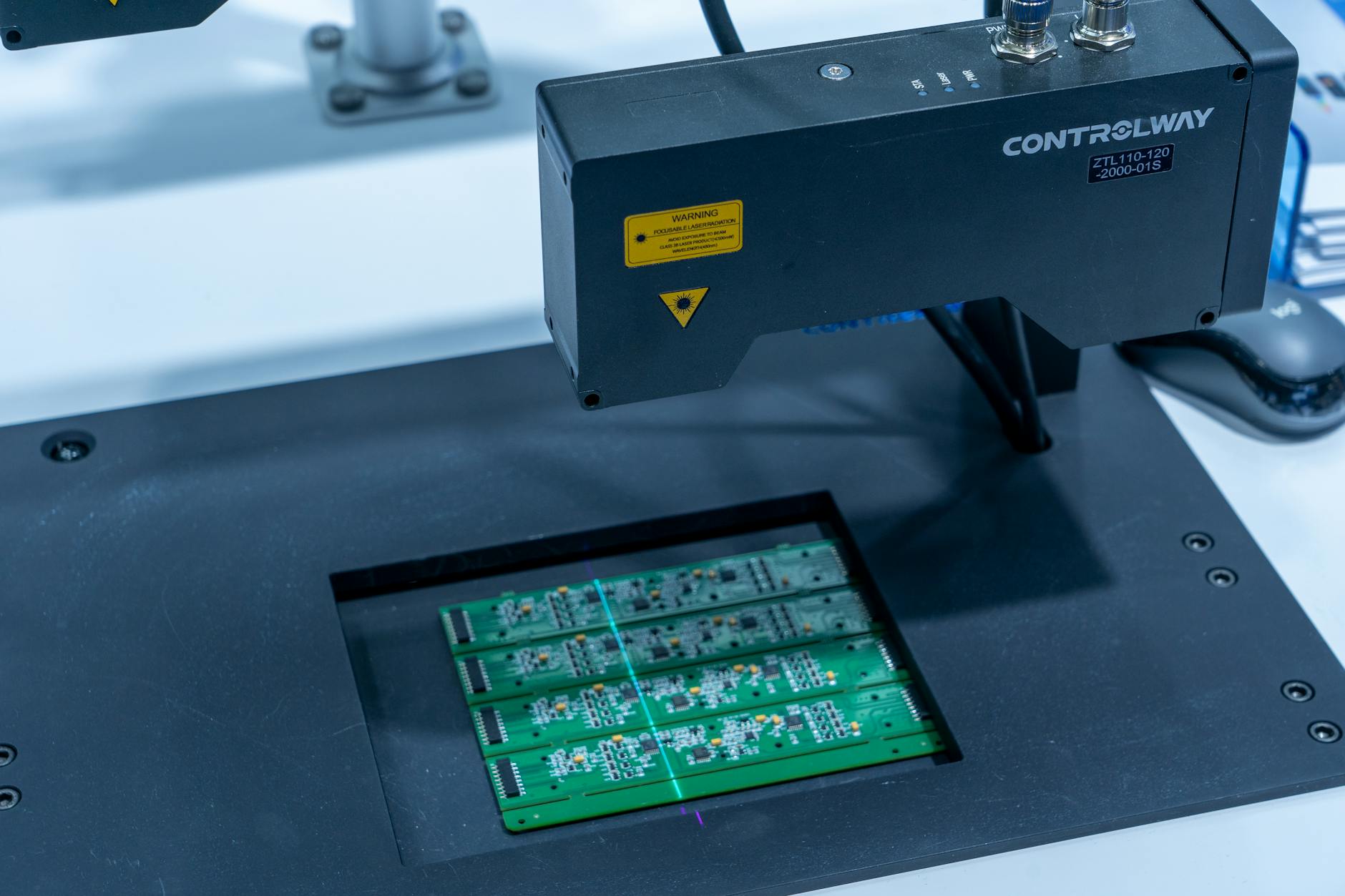 Close-up of biometric fingerprint scanning device with blue LED lighting