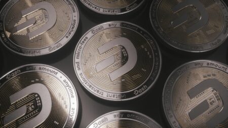 Steve Jobs Commemorative Coin Launches at $61 Per Roll Collection of commemorative coins displayed on a dark surface
