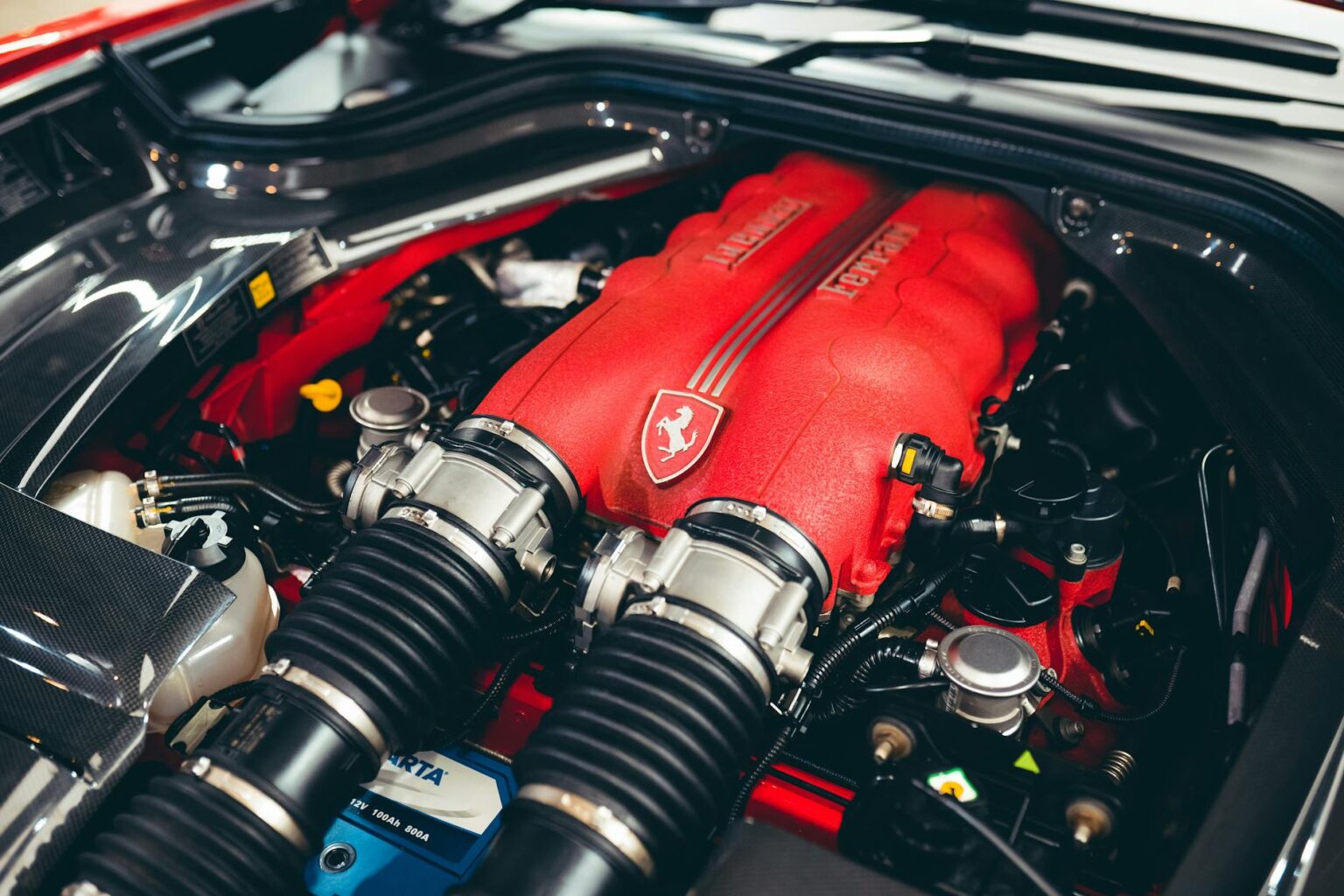 Lotus Abandons Electric-Only Plan, Returns to Combustion Engines Close-up view of a high-performance car engine compartment