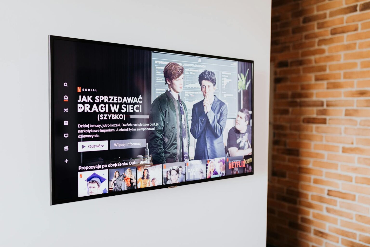 Person watching streaming content on mobile device