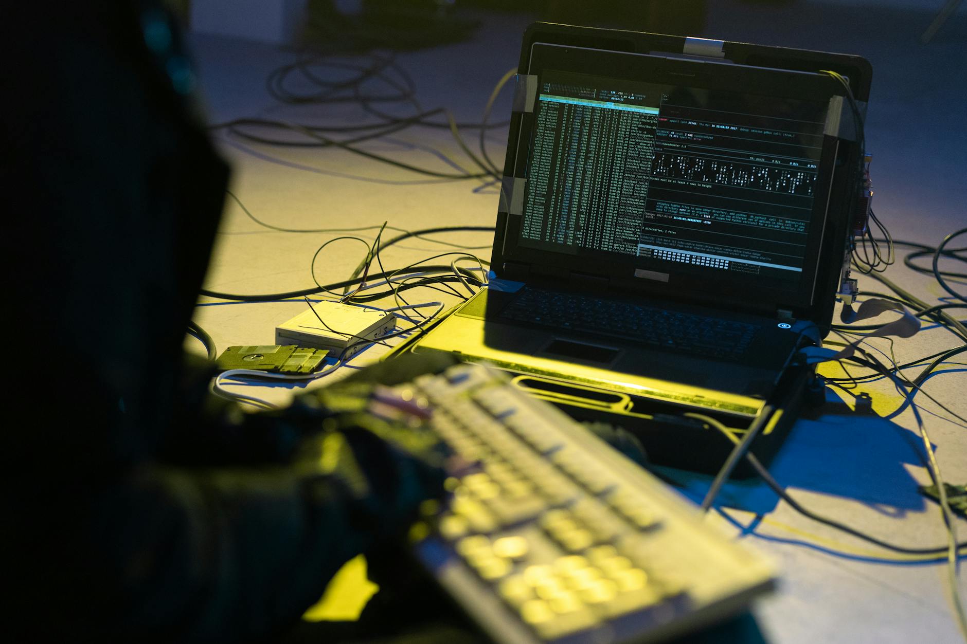 Person working on computer with security code on screen