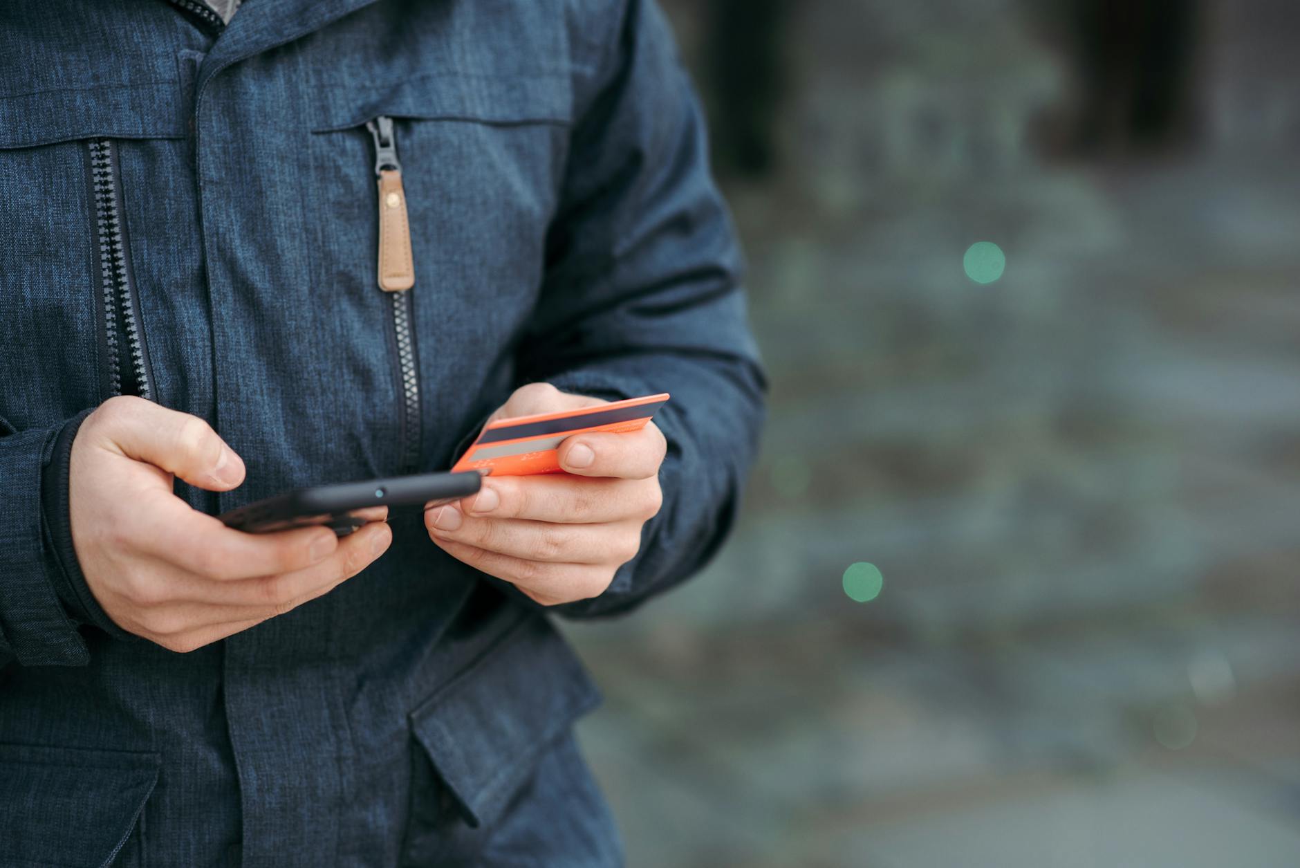Person using mobile payment application on smartphone screen