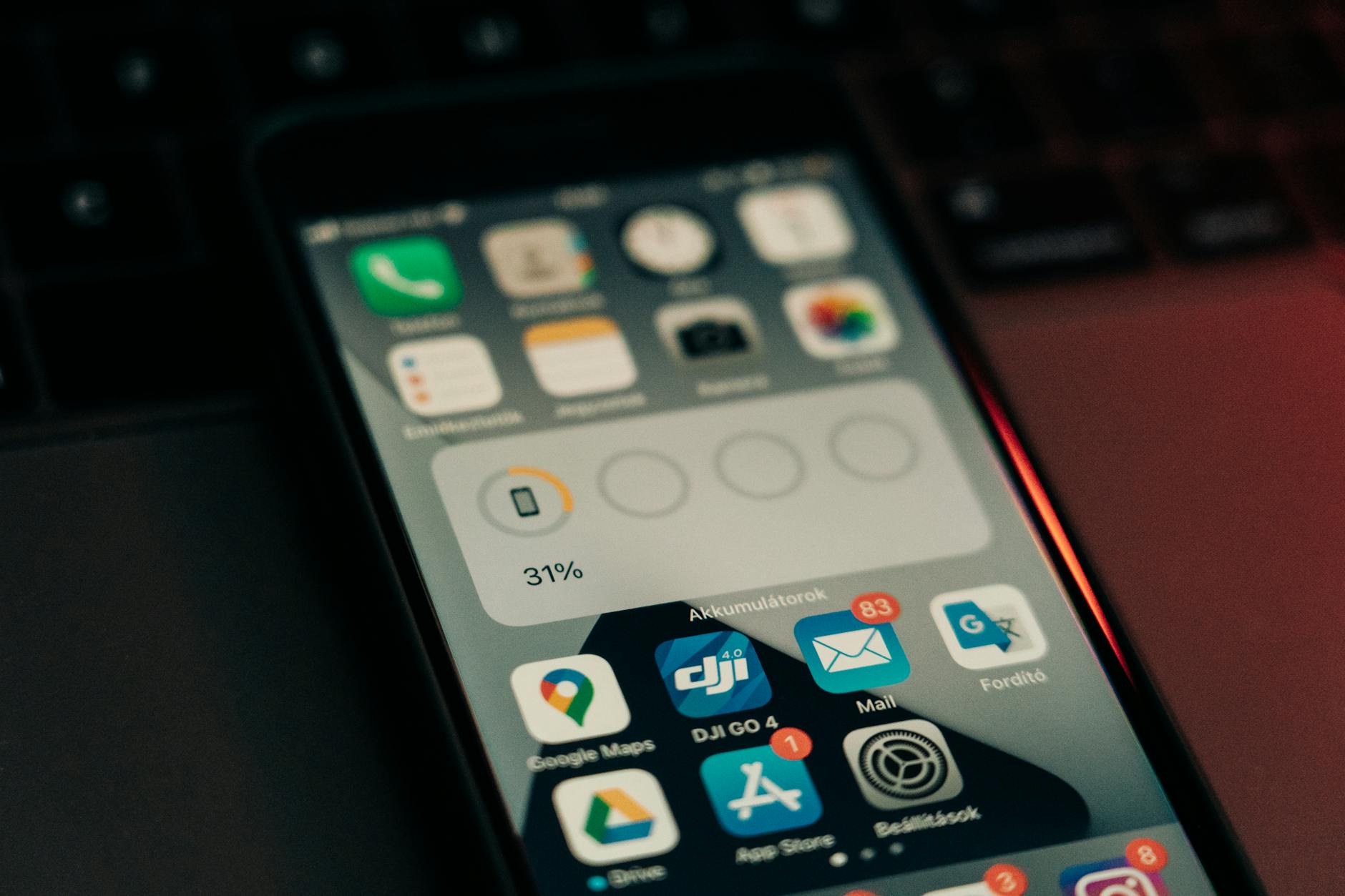 Person using smartphone with App Store interface visible