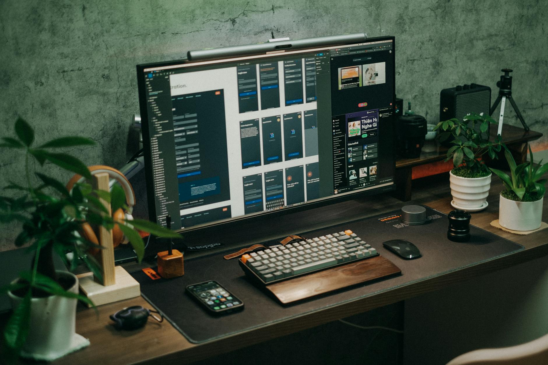 Multiple computer monitors on a desk showing display management interface
