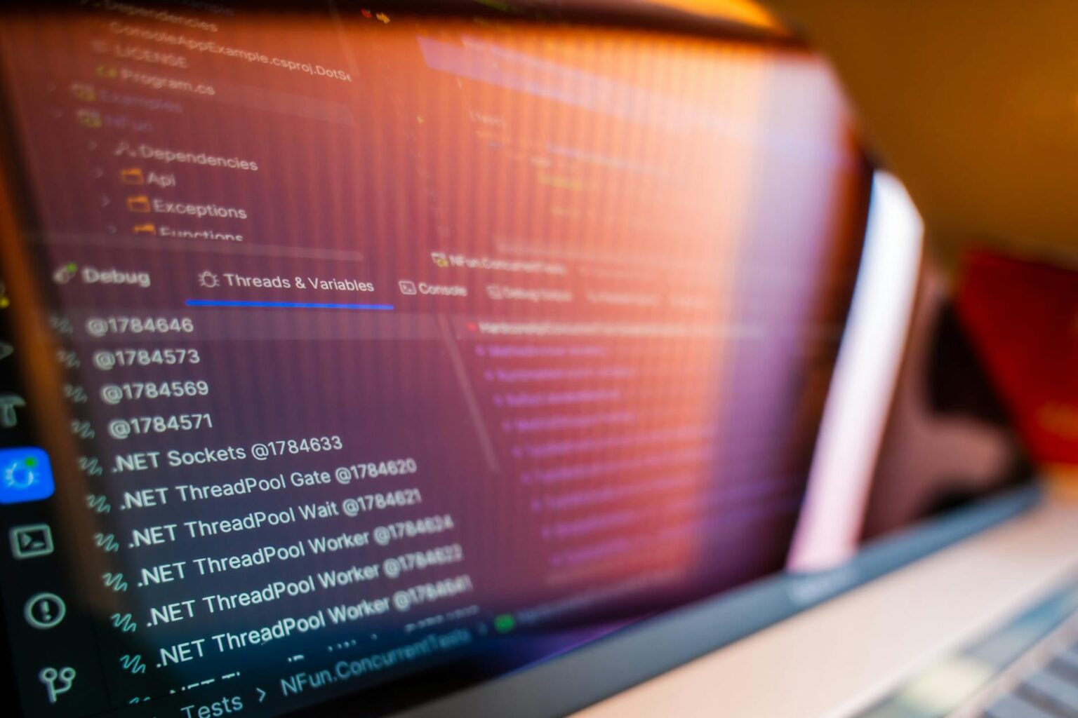 Developer working on code interface showing programming languages