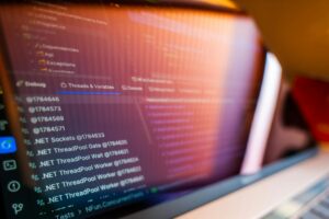 Developer working on code interface showing programming languages