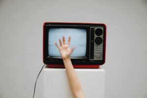 Modern television displaying streaming content in dark room