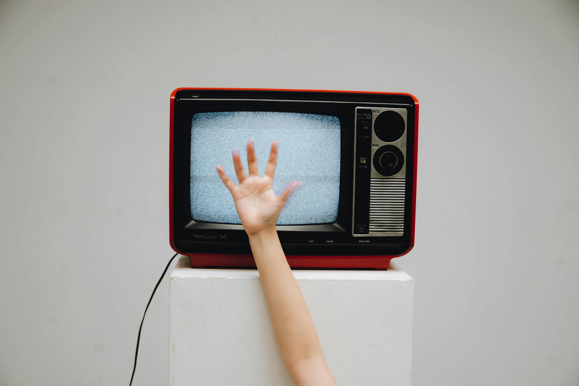 Modern television displaying streaming content in dark room