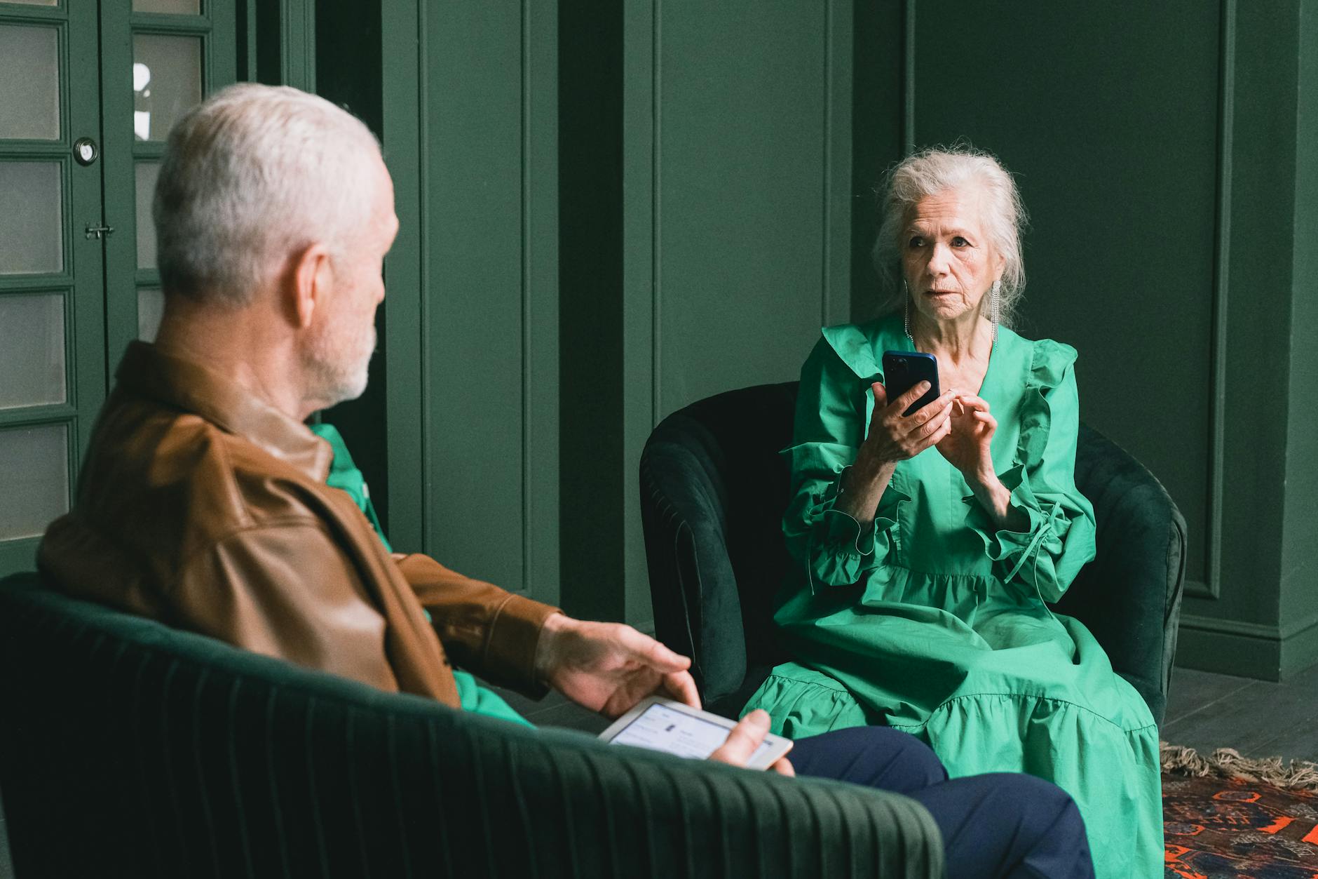 Senior citizen using smartphone showing potential vulnerability to online scams