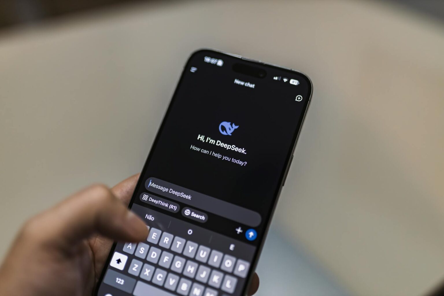Person using smartphone with AI chatbot interface on screen