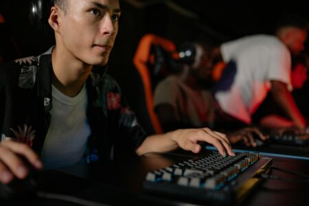 Large esports tournament venue with multiple screens and competitive gaming setup