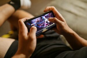 Person watching video content on smartphone screen