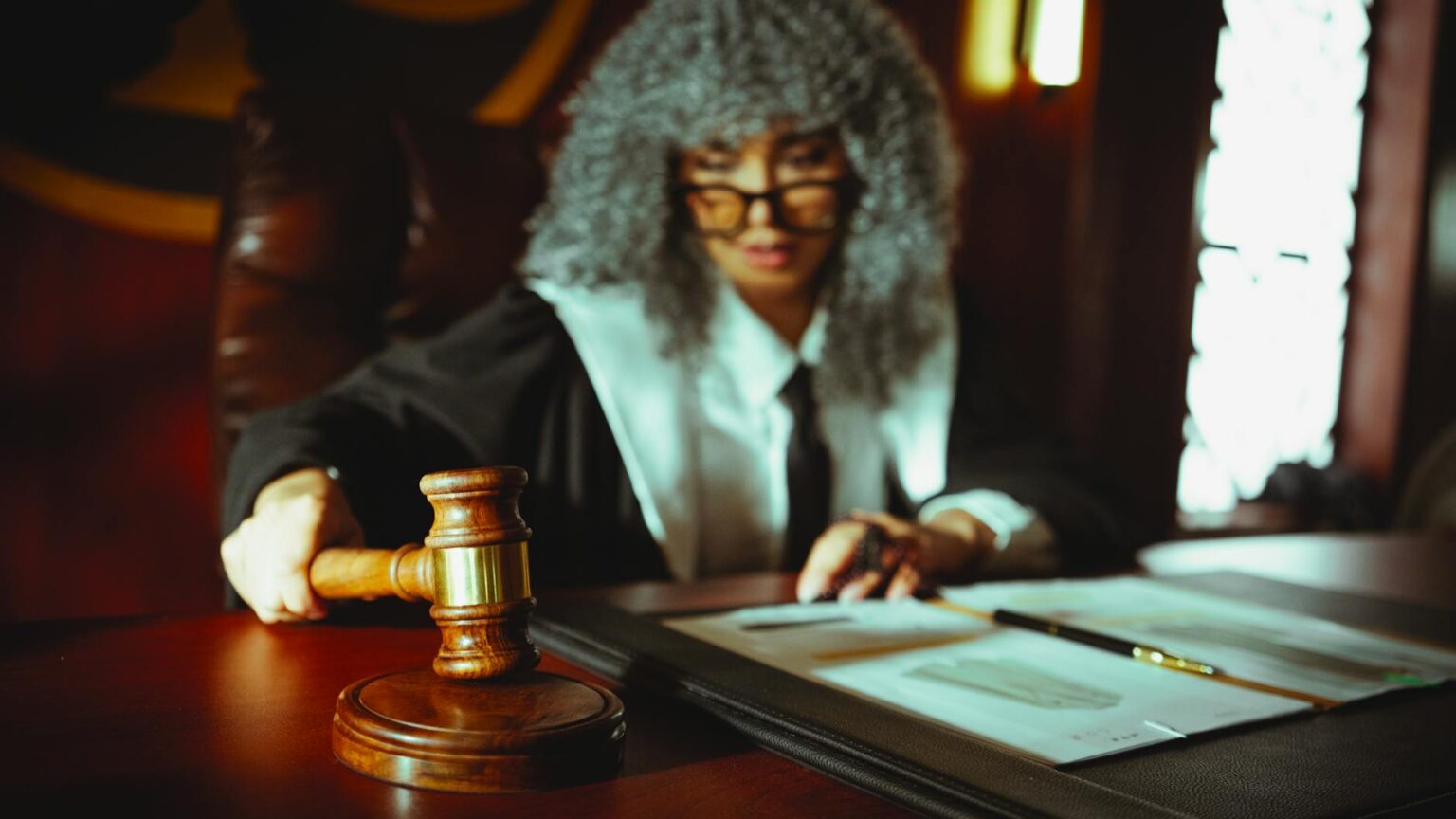 Judge's gavel on wooden desk representing legal proceedings