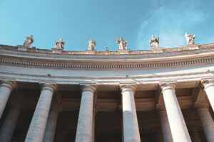 Pope Leo’s AI Encyclical Goes Beyond Artificial Intelligence Exterior columns of a grand Vatican-style building representing institutional authority